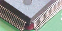 Figure 6. Example components that have been reflowed on the base of the board with the adhesive holding the parts in place during a single reflow soldering cycle in a convection oven